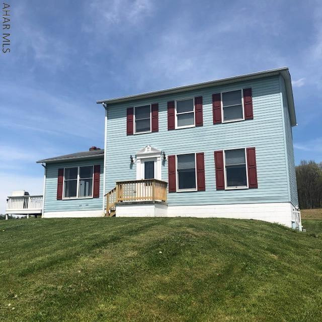 This spacious home is situated on a two acre country setting has loads of living options on every level. Enjoy the basement level must-have mudroom, family room with fireplace and convenient half bath. Moving to the second floor you have an updated kitchen, dining area with french doors leading to the living room, another family room with fireplace and access to the side deck w/awning and an extra room used as an office with a 3/4 bath - this room could be a possible main floor master for a total of four bedrooms. The second floor has an additional full bath and three more bedrooms with access to an attic area. This property is just minutes to Dunnings Creek and Bobs Creek and a short drive to Blue Knob Ski Resort and many other attractions in beautiful Bedford County PA.