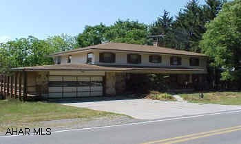 Must See!!  New roof, stone and wood sided, beautiful lot- two decks 5 BR, 4 Bath, a wraparound deck, large room, finished basement with eat in kitchen on .89 acre level lot. Air cond central & window.  Exterior Brick/Stone-Wood. Must See!!  New roof, stone and wood sided, beautiful lot- two decks 5 BR, 4 Bath, a wraparound deck, large room, finished basement with eat in kitchen on .89 acre level lot. Air cond central & window.  Exterior Brick/Stone-Wood.