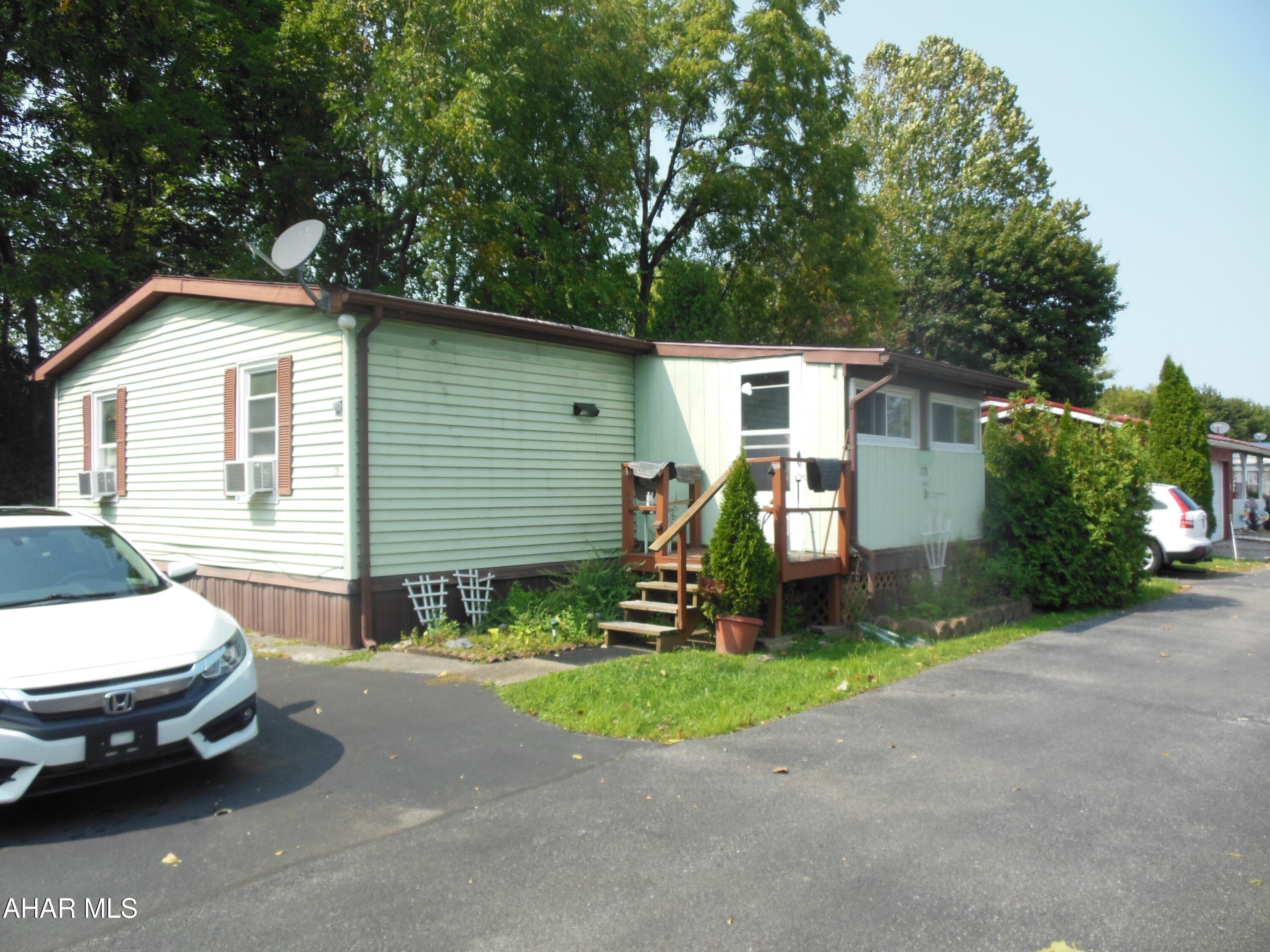 Eldorado Mobile Home Court! Senior 55+ living.  Spacious, double-wide (24' x 40'') in Eldorado with appliances, shed, garage and rear private deck area. Level lot and area for walking, etc. These homes don't last long because they're inexpensive living compared purchasing a home with high taxes, and close to shopping. This is one of the larger homes. Cash or equivalent. *Enter Court on Brookwood Drive and follow to the right. The rent for that lot is $690 per month includes trash.