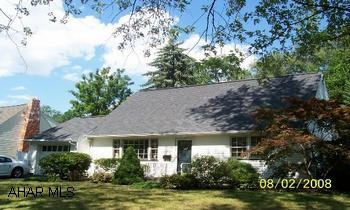Cape Cod on large lot.   Hardwood floors, newer furnace and central air.  First floor bedroom and bath.