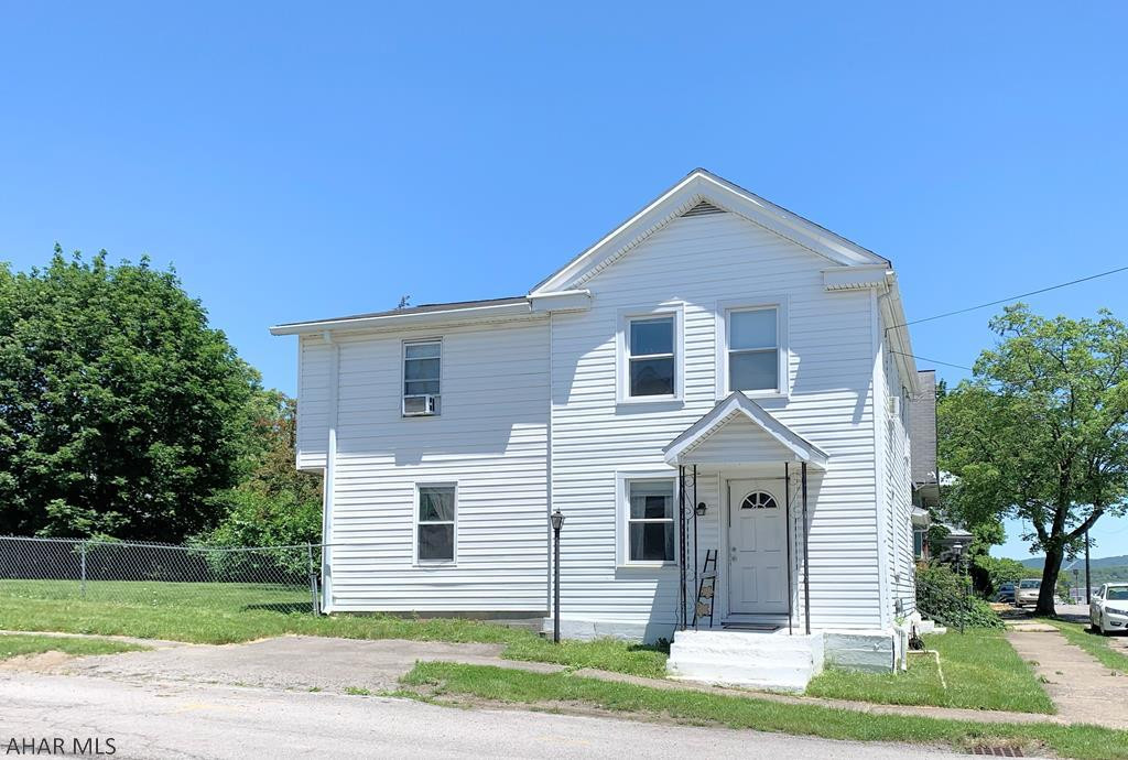 Hollidaysburg borough. Large 4-5 bedroom 1.5 bath home that offers a large kitchen, living room, dining room  w/ laminate floor, and family room. Full bath that has been recently updated with new sink and flooring. 5th bedroom currently used as a large dressing room/closet. Newer carpet, nice fenced in yard with a shed and off street parking. Covered patio and covered porch.