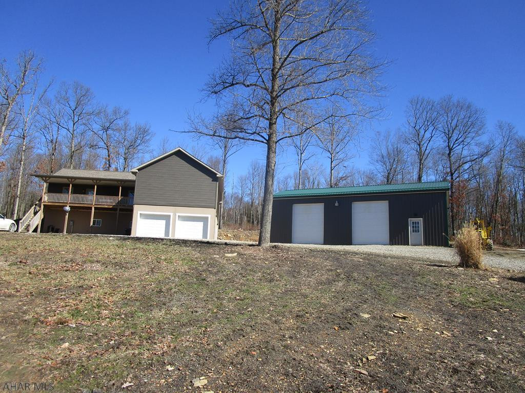 Private location Horse farm on 71+ acres with a beautiful 2014 modular home. The home features 3 bedrooms and 2 baths, large open concept kitchen with abundance of oak cabinets, separate laundry room and large living room. Front and rear decks. Basement is superior wall foundation with 10' ceiling height. 2 car integral fireproof garage. To save on heat costs there is an additional coal/wood furnace that heats garage and house. 30x50 as new garage includes insulation with 14 ' ceiling height and concrete floor. Outside dog kennel.  Horse barns with 6 stalls and pastures. Arena measures 100x200 for riding along with a round pen (needs fencing). Workshop building includes a walk in cooler. Private setting with plenty of deer. Truly a remarkable property for those who want country living!