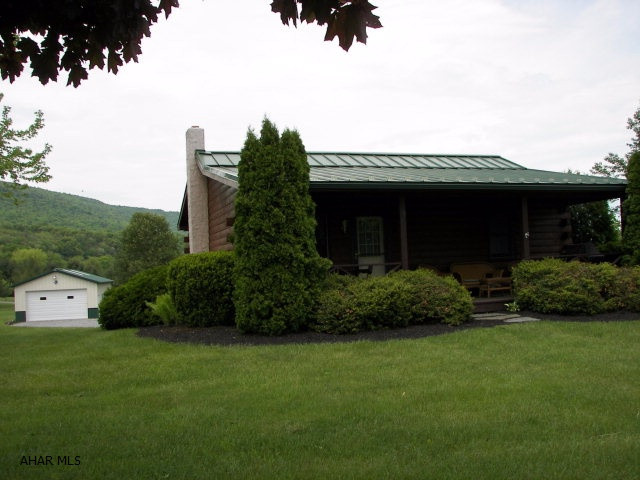 Everything is on your checklist when looking at this Log Home! Easy maintenance, move in ready, & a place for the boat! AND minutes from the Aitch Boat Launch area of Lake Raystown for Summer Fun! The seller is conveying all furniture, & linens making this a turn-key opportunity.This meticulously maintained 2BR, 1 BA home situated on 1.95 acres offers a great location for a vacation home or year round living. The front porch invites you to sit and enjoy the views and evening stars. The location of the detached 35' X 40' garage for the boat provides plenty of room for maneuvering! Annual 100$ HOA fee is for road maintenance. Call for your showing today!