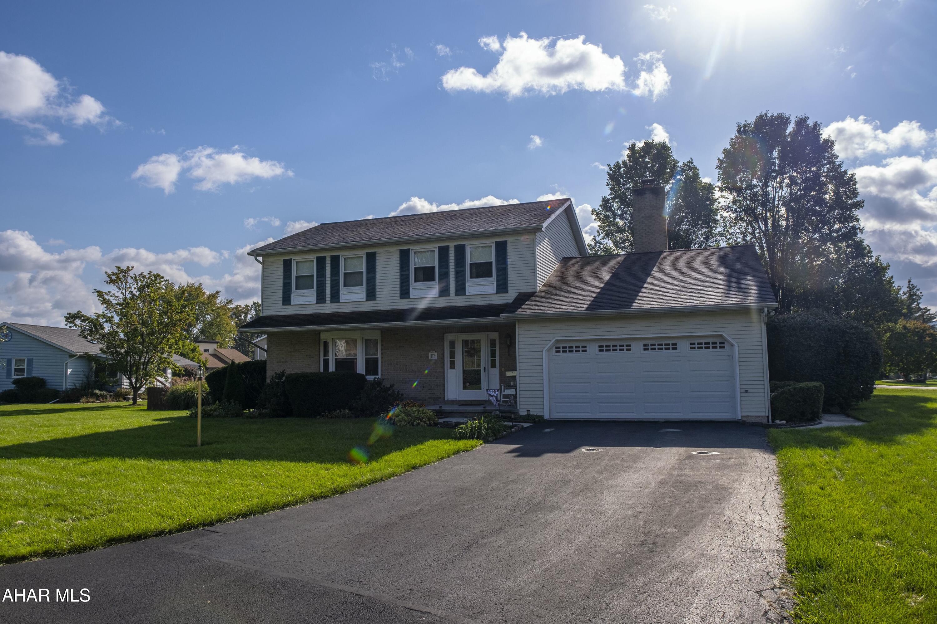 This charming home offers a perfect blend of spacious living and cozy comfort. This home includes a spacious dining room ideal for entertaining, additional bonus room that could be used as office space, and a well-appointed kitchen with access to an outdoor screened-in sunroom. The cozy family room boasts exposed beams, built-in shelves, and a gas fireplace, creating the perfect atmosphere for relaxation. The first floor features a convenient half bath and a separate laundry room, enhancing both functionality and ease of daily living. The second floor has new carpet throughout, three bedrooms with spacious closets, and a full bathroom. The master bedroom includes three closets, perfect for those clothes and shoes and a private ensuite. This home offers two separate attics for ample storage. One is above the garage, ideal for seasonal items and tools, while the second, above the second-floor bedroom, provides extra space for clothes, bedding, or decorations. Plenty of room for all your storage needs! Heated 2-car garage and spacious driveway. The fenced-in backyard offers privacy, making this home perfect for both indoor and outdoor living. Located within the highly sought-after Hollidaysburg School District, this home is tucked away in a peaceful development. The neighborhood offers a quiet, serene setting while remaining conveniently close to local amenities. With flat terrain, it's an ideal area for walking and biking. Don't miss the opportunity to make this wonderful property your new home!
