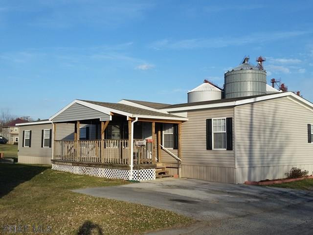 Beautiful 2011 double wide with 1976 square feet, nice front porch, family room, 4 bedrooms and 2 baths. 2016 Taxes = $1,927.28 reassessment estimated 2017 = $1,535! Lot rent only $200./mo includes trash. New owner must be approved by lot owner Gene Henry who must approve lot lease 793-2221.    #J-374