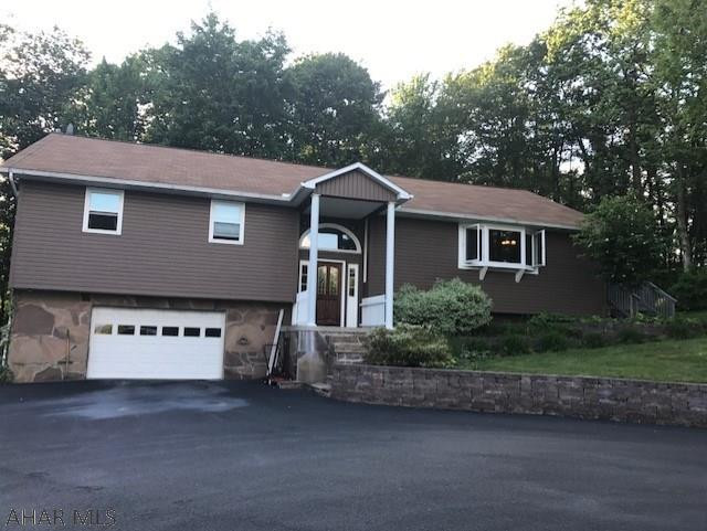 Absolutely beautiful home in a stunning location. Newer windows, new gutters, new furnace, 3 bedroom, 3 full bathrooms, very large open concept living room/dining room, finished basement, gorgeous woodwork, macadam driveway, and lovely yard.  Wrap around deck and very private.  Don't miss this one!!!!