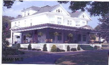 ORIGINAL HARDWOOD PARQUET FLOORS. LRG. FOYER & HALLWAYS W/ ELABORATE WOODWORK.  DUPLICATE HOME BUILT IN NORTH CAROLINA & PHILLI.  ROOF 6 YRS. OLD. 402 LYNN ST.  MADERA PA 16661 MOSHANNON VALLEY SCHOOL DISTRICT.YOUR DREAM HOUSE IN THE MOUNTAINS.  COUNTRY VICTORIAN MANOR RESTORED TO ELEGANCE.  WORKMANSHIP & MATERIALS NOT FOUND TODAY.  8000 SQ. FT. HOUSE W/ 1000 SQ. FT. , OFFICE ATTACHED TO REAR OF HOUSE W/ PARKING LOT, 3 DRIVEWAYS.  HUGE REC. ROOM ON 3RD FLOOR W/ HUGE CEDAR CLOSETS.