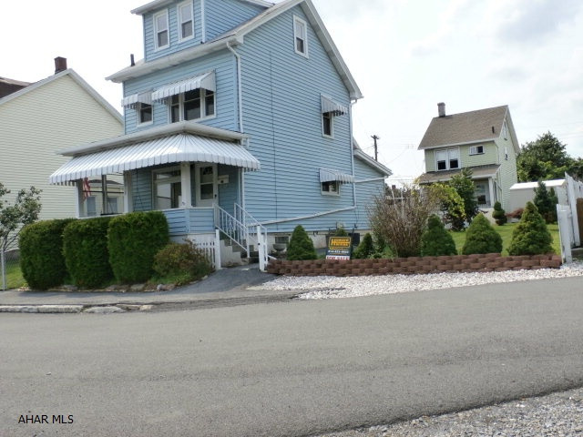 MOTIVED SELLER !! Nice starter home or great for down sizing. Also would be a good rental property. Don't worry about a lot of grass cutting. Small yard but still enough room for picnic table and lawn chairs. Covered front porch with awnings and a swing. Enjoy  a cool breeze and a beautiful view from the front porch. Very close to prospect swimming pool for those hot summer days. With a few homey touches, this will be a comfortable house to call home. Whole house air conditioning, newer hot water tank - two to three years old. Furnace in good condition and well maintained. Also a storage shed is a bonus.