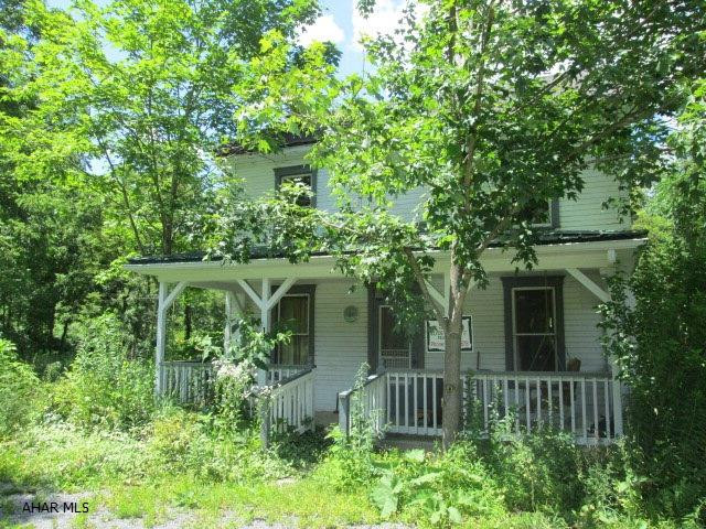 Lot currently has an old two story house that needs razed.  Lot size is based off current Survey. Current on site water and sewage disposal systems are unknown.  Part of the site has a stream and is in the 100 year flood zone, part of the site is out of flood zone.  Surveyor indicated that due to the flood zone, Tyrone Township Setbacks and Utility Easements on the site a variance from Tyrone Township would be required to build a home on this site.  Current house appears to be out of flood zone.  Any Sales Agreement will require the following statement:  Sales Contingent upon Blair Senior Services remaining as power of attorney for Harriet M. Snare.  If Blair Senior Services is removed from Power of Attorney, contract may be considered null and void.