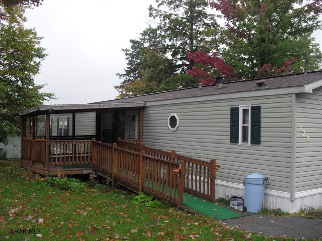 16x80 1999 Champion home. Move in ready. Home has many fine features. new windows and beautiful porch. Home is on a rented lot. rent is 317.00 per month which includes garbage and sewage. A must see!
