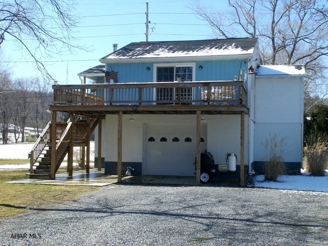 Raised ranch w/ full foundation. Two bedrooms, kitchen, dining area, living room, 1 bath. Good condition, entire property has been remodeled. Oak kitchen cabinets, heated bsmt, wrap deck, sliding glass LR doors w/ stream view. Shingle roof, thermo pane windows, vinyl siding, natural gas radiant heat & 200 amp service.