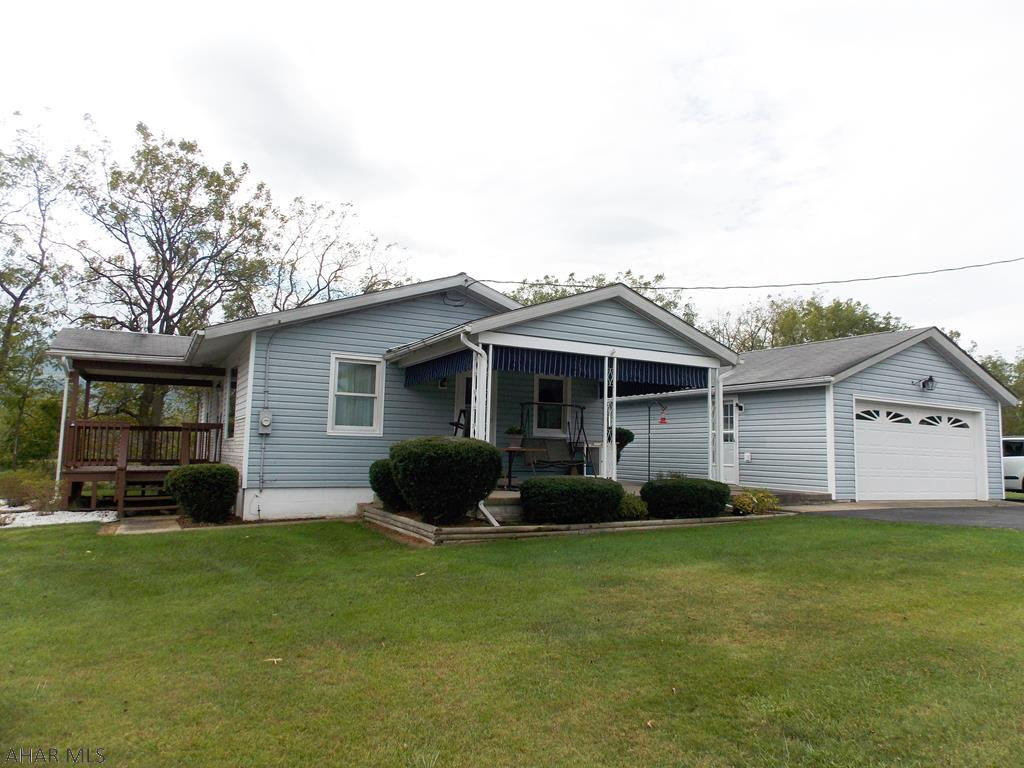 Charming ranch home on the outskirts of town! Eat-in kitchen features tons of cabinets, stainless steel appliances and a tile backsplash. Lovely living room that is very spacious. Bedrooms have ample closet space. New furnace and Air conditioning in September 2019. Large 2 car garage and a 1 car garage will give plenty of storage. Enjoy the amazing view from the front porch! So peaceful and private! If you love a country setting this home is perfect!