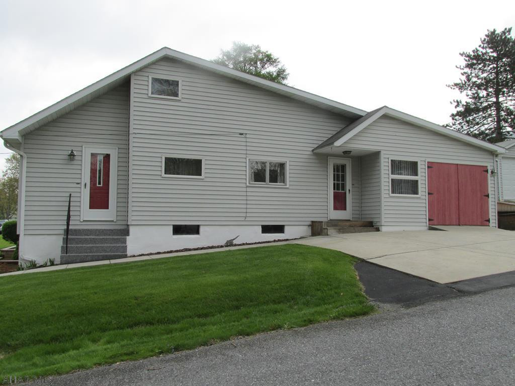 Unique Story & half home in Logan Twp.  Low taxes, Maintenance free exterior 4-5BR, Eat-In Kitchen, 2BA, 3 one Car garages, Gas hot water heat, w/ space wall units for air conditioning.  100 AMP Breaker panel, All appliances included, Flat screen TV in Master included, Furniture in second fl BR included, loads of storage and well insulated.  Perfect starter home!  Sold "As Is