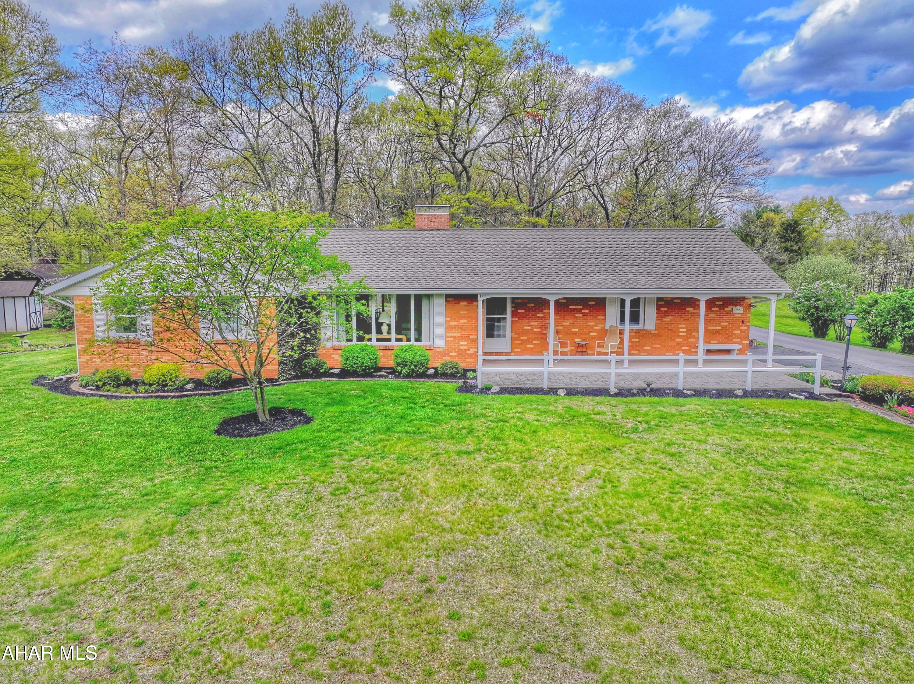 Lovely Brick Ranch home with 1.68 acres. This home has been lovingly cared for. One level living including laundry with washer and dryer. Two Bedrooms and 2 Baths. Large living room with inviting wood fireplace. Bonus room that could be a third bedroom or office. Basement is partially finished has a Family room with woodstove and a pool table that is included. Old cook stove in working condition in basement,  Heating is a heat  pump and also has central air. Outside there is a beautiful yard just freshly mulched , stunning blooming trees and a comfortable front porch to sit and enjoy the outdoors. Attached one car garage and detached shed. Furniture left in home is negotiable. House is located off Ritchey Rd onto Berks Rd. Call to get an appointment to make this your home!