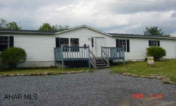 Location, Location, Location!!!    This Logan Township 3BD  2 Bath doublewide sits on very nice private lot in a great location. Needs a little TLC but has great potential.  Totally fenced in lot (approx. 1/3 acre owned not rented), 2 story shed with electric, fire-pit, basketball court and more.  Must see to appreciate. Motivated Seller!!  Call Debby Gottberg for more information at 931-2997.