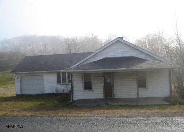 Tipton area one story home on nice lot. Needs some TLC, but loads of possibilities. One Car attached garage and covered front porch. Property is being SOLD AS-IS.