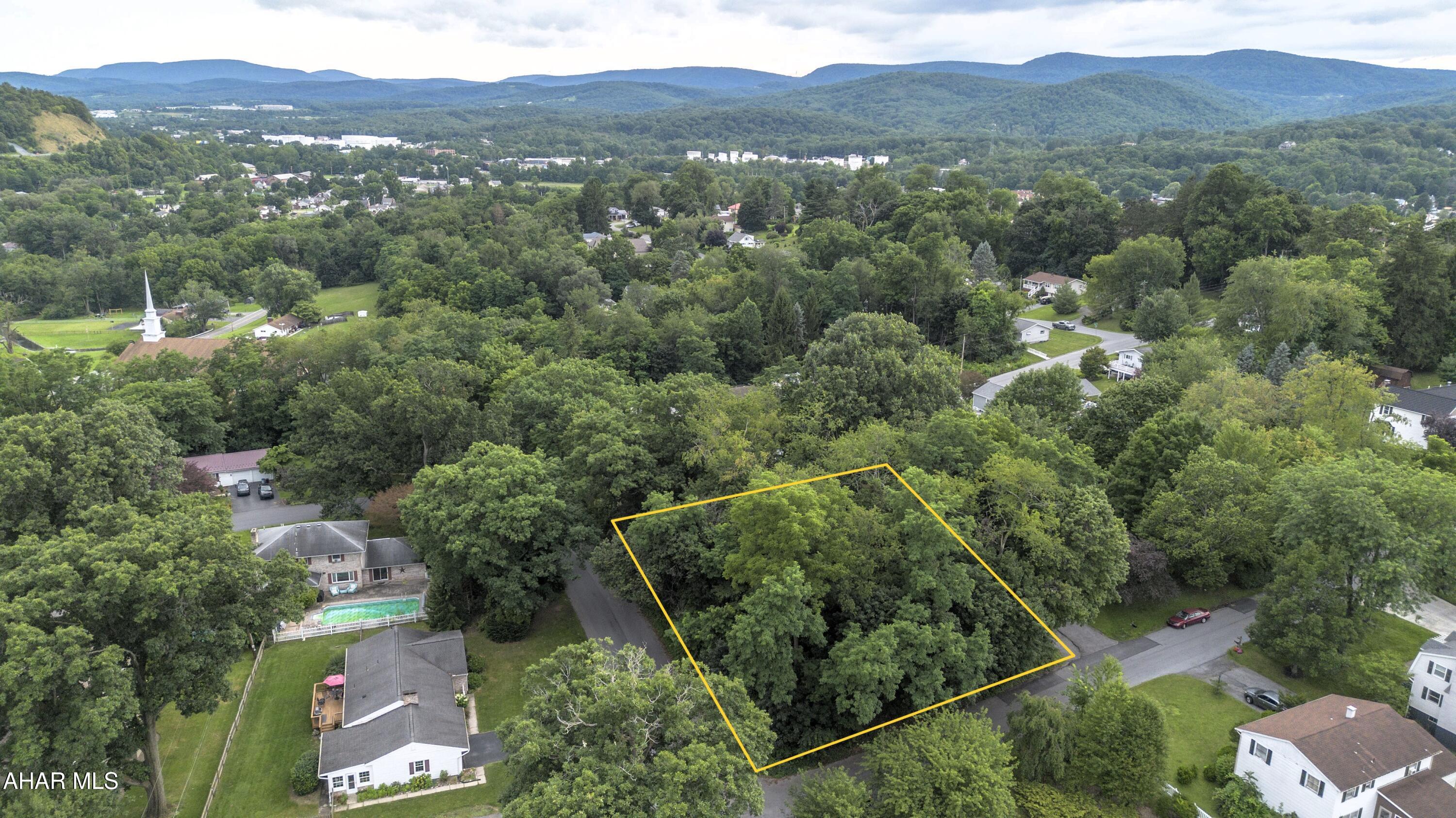 Fantastic opportunity to build your dream home! This level corner lot offers maximum flexibility for your building plans, while mature trees provide the option for added privacy or a custom-designed setting. Located in the desirable Highland Park area of Altoona on a low-traffic street, this property has public water, sewer, and utilities available, making it ready for your vision!