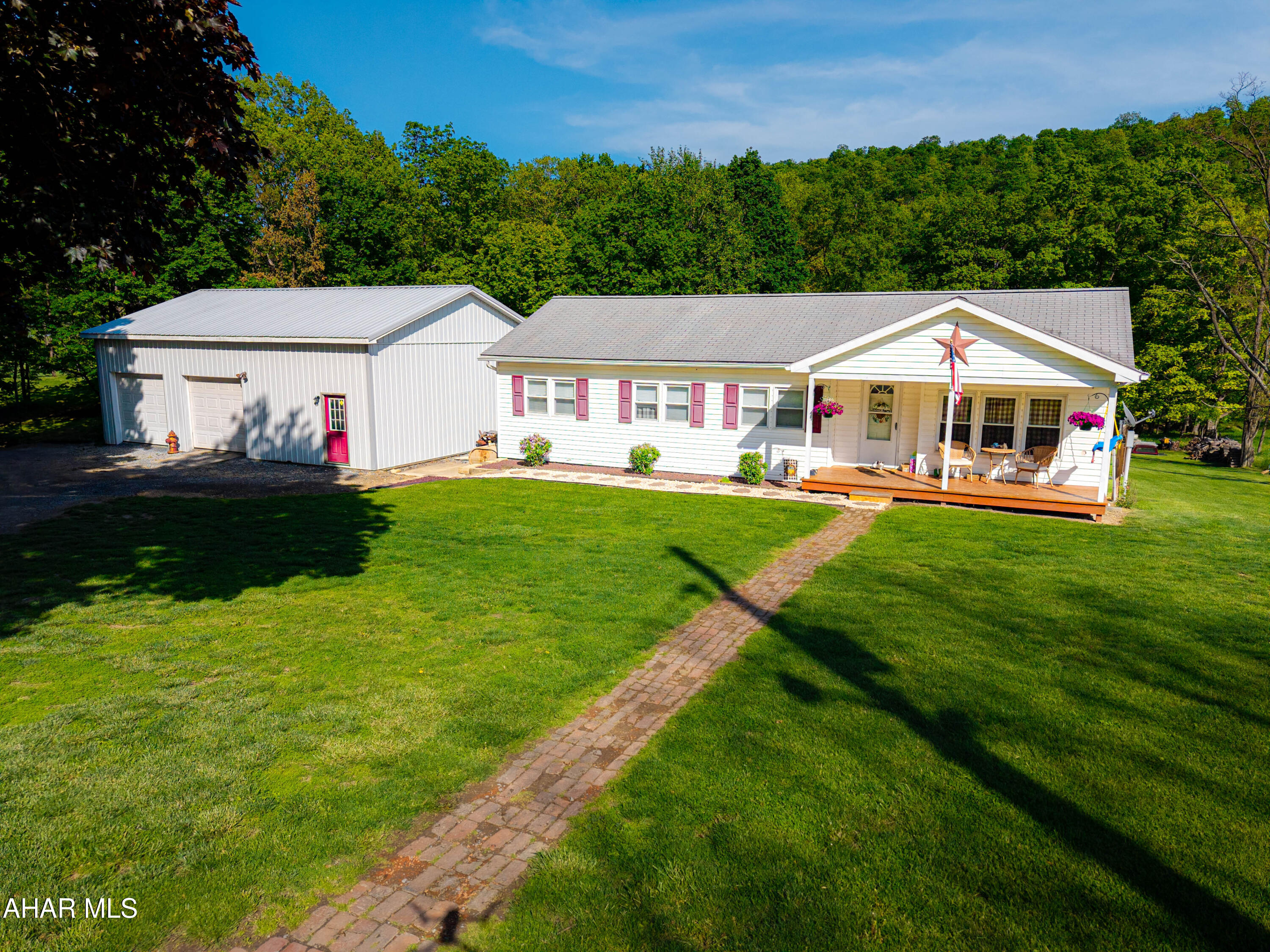 Welcome to 2233 Cumberland Road! Nestled on two acres, this beautifully updated single level home offers a rare blend of comfort, simplicity, and practical living space. Featuring three spacious bedrooms, two full bathrooms, a large living room, a well-appointed kitchen perfect for preparing meals, and lovely dining room ideal for entertaining. Breathtaking views from every angle, especially from the front porch. Cool off in your own above ground pool during warm days. The large, detached garage, equipped with heat, provides ample space for vehicles and outdoor equipment. The outdoor furnace, fueled by wood or coal, heats both the house and the garage. The expansive private yard offers endless possibilities, including the potential for keeping animals. With a private well and sewer system, this property is conveniently located just minutes from Bedford, ensuring an easy commute to town or Cumberland, MD. Could this be your next Home Sweet Home?