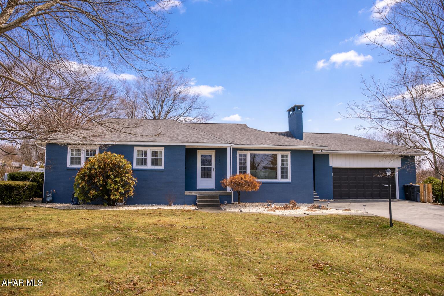 Beautifully remodeled ranch home located on a quiet street in the highly desirable Hollidaysburg School District within Sylvan Hills. This well maintained home features 3 bedrooms, 2.5 bathrooms, and a fully finished basement offering plenty of additional living space.

The home has been thoughtfully updated throughout with a remodeled kitchen, new paint throughout, updated light fixtures and ceiling fans, and nice hardwood floors. The kitchen and bathrooms feature new tile flooring, adding a modern touch to the space. A brand new combination boiler heating system has also been installed for added efficiency and peace of mind.

Enjoy the spacious living room featuring a cozy wood-burning fireplace, or relax in the lower level family room complete with a wood stove, perfect for keeping warm during the winter months.

A beautiful covered porch provides the perfect space to relax or entertain. This inviting area features string lighting, a ceiling fan, and window shades for added comfort and privacy, creating a cozy space to unwind while overlooking the backyard and pool area.

Step outside to a fully fenced backyard designed for both relaxation and entertaining. The large deck surrounds a heated swimming pool, creating the perfect summer retreat. The property also features beautiful landscaping, raised garden beds for planting, and plenty of space to enjoy the outdoors.

Additional highlights include a large 2-car garage and a fantastic location close to everything Hollidaysburg has to offer.

This home truly has it all! space, updates, and an incredible outdoor setup. Call today to check it out.