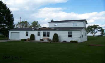 Fabulous country setting convenient to Roaring Spring & Martinsburg.  5 Bedrooms/1 Bath. 3 Bedrooms on first floor.  First floor laundry.  Beautiful new deck onto wonderful backyard. Replacement windows.  1-car attached garage.  Priced to sell!   Fabulous country setting convenient to Roaring Spring & Martinsburg.  5 Bedrooms/1 Bath. 3 Bedrooms on first floor.  First floor laundry.  Beautiful new deck onto wonderful backyard. Replacement windows.  1-car attached garage.  Priced to sell!  Home is a doublewide with a large 2-story addition.  Please qualify all buyers for this type of mortgage prior to showings.  Approx. 6 houses before The Prospector on Cove Lane.