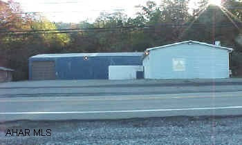 Located between Duncansville Intersection and Newry along Route 220. Includes 3,000 sq ft metal garage with 14'  ceilings overhead door and oil heat.  Also block office building. Good for car or truck repair or sales.  Public seewer available. Heat is oil Located between Duncansville Intersection and Newry along Route 220. Includes 3,000 sq ft metal garage with 14'  ceilings overhead door and oil heat.  Also block office building. Good for car or truck repair or sales.  Public seewer available. Heat is oil/hot water.