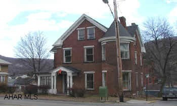 2 1/2 Story Brick duplex.  2 bedroom apartment on each floor.  2 furnaces, 2 electric services.  Vacant.