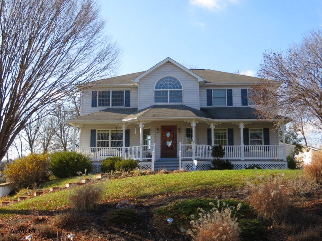 Beautiful and spacious VICTORIAN in Hollidaysburg School District with 3-4 bedrooms plus bonus room, 2 lovely porches!  Lovely open 2 story foyer and formal dining room and kitchen have hardwood floors. Kitchen has brand new granite counters and newer stainless appliances. Family room with gas fireplace open from eat in kitchen is great for entertaining. Extra large master has walk in closet and 3/4 bath with double bowl sink.  Bonus room off master is great for sitting room, office or nursery and has great view! 2 other large bedrooms on 2nd floor, one with double closet. Finished area in basement has another bedroom, family room and large 1/2 bath. 1st floor laundry/mud room.  Hot tub off screened in porch. New carpeting throughout.  HURRY! A MUST SEE!