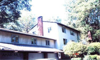 PROPERTY WITH GREAT POTENTIAL.  ATTACHED APARTMENT TO HOUSE, GAZEBO OVER HOT TUB, SPA, INGROUND POOL, LOVELY SUNROOM.  ADDITIONAL PROPERTY (BLUE BUILDING) CAN BE INCLUDED FOR A TOTAL OF $350,900.  3 CAR ATTACHED GARAGE AND 2 CAR DETACHED GARAGE.