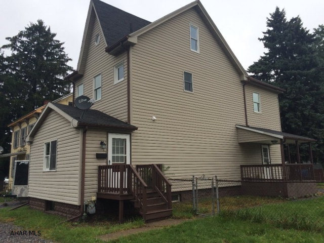 TOY TOWN - REDUCED to $123,900!  Nicely Renovated Spacious 3-4 bed, 1.5 bath 2 1/2 story on level double fenced lot with off street parking in front and back. Huge formal dining room, living room, eat in kitchen and master with attached bonus room that can be a nursery, walkin closet or office. Central air, thermopane windows, new doors, 1/2 bath and laundry on the first floor. Updated and large eat in kitchen has brand new stainless appliances. Washer and dryer in laundry area can be installed before close. Central air. Seller to consider Seller Assist with acceptable offer.