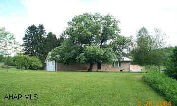2000 SQ FT Rancher on 10 acres-w/New Maple Kitchen 1500 sq ft. Masonry bldg w/ 12' Ceiling (Formerly used as a slaughter house)-Barn-Log Cabin-Pond- Fruit Trees, 2 Heat Sources,2 Water Sources