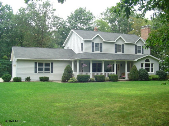 Immaculate home on 1.1 acre lot. Privacy but close to shopping and schools. Solid oak trim & doors throughout. Ceramic tile, beautiful finished Familr Room with bar in basement. Fireplace on first floor with propane logs also could burn wood. Nice workshop with electric, water, and cable. Within walking distance to State Gamelands.