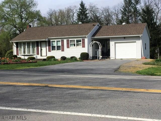 This is a very well maintained property just minutes from Bedford in the village of Wolfsburg.  It is a solid 2 bedroom house with breezeway and garage.  The house is nicely landscaped and  includes the lot beside which gives you plenty of room for gardening and play.  There is a small stream at the rear of the lot with an area that was recently used for family picnics complete with an outside fireplace. This is a great home perfect for a small family or a retired couple.
