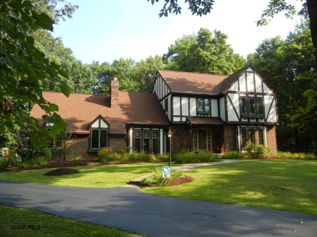 Very well maintained Tudor style home situated on over an acre. Heated inground pool with FP & entertaining area. Pond with Koi. Theater room in lower level with full kitchen. Main kitchen with island, Jenn-air & eating area. 2 FP's-1 woodburning, 1 gas. Hobby/art room with sink. Central vac. Home protection plan included. This is a must see home. Owner says SELL!!!