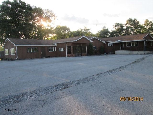 This could be a great restaurant again or used for other purpose. There is living quarters behind the restaurant with a 4 car garage. Could be great car lot or other retail space. Large paved parking area.