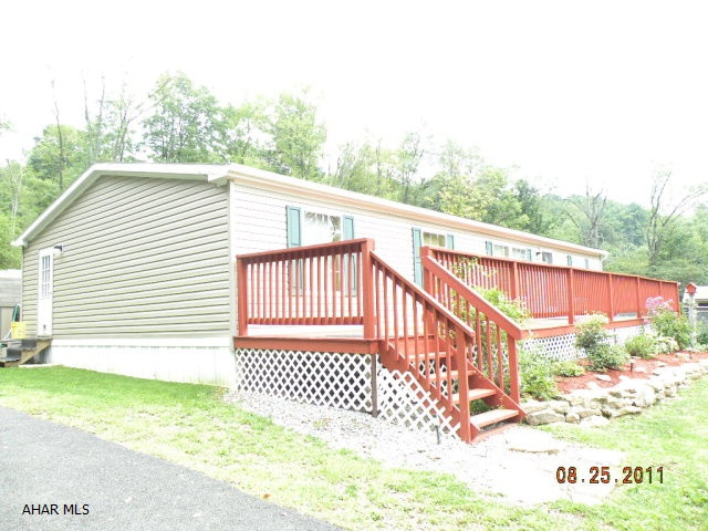 Immaculate double wide on 4.5 acres (country setting) Northern Cambria schools, master bath w/ garden tub, walk-in closets, appliances included, front & back decks, fenced yard & shed