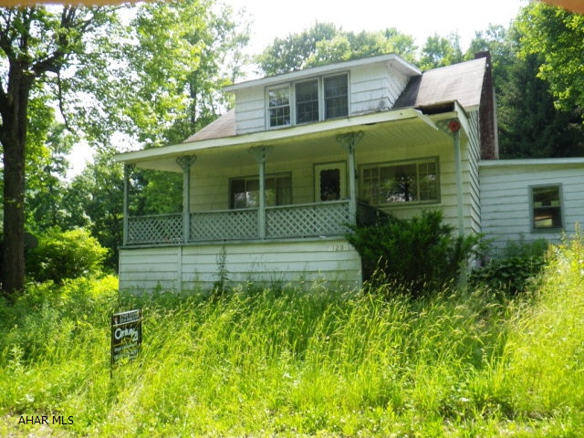 Northern Cambria- Susquehanna Twp- 2 BR Cpe Cod handi-man special. Needs lots of work. 7 acres. Includes 3 car garage with apartment. Public utilities. Poor condition- being sold as-is. Cash or conventional Mortgage.