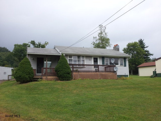 2 bedroom rancher with full basement on .539 acre. Central air conditioning. 2 car detached garage with workshop.