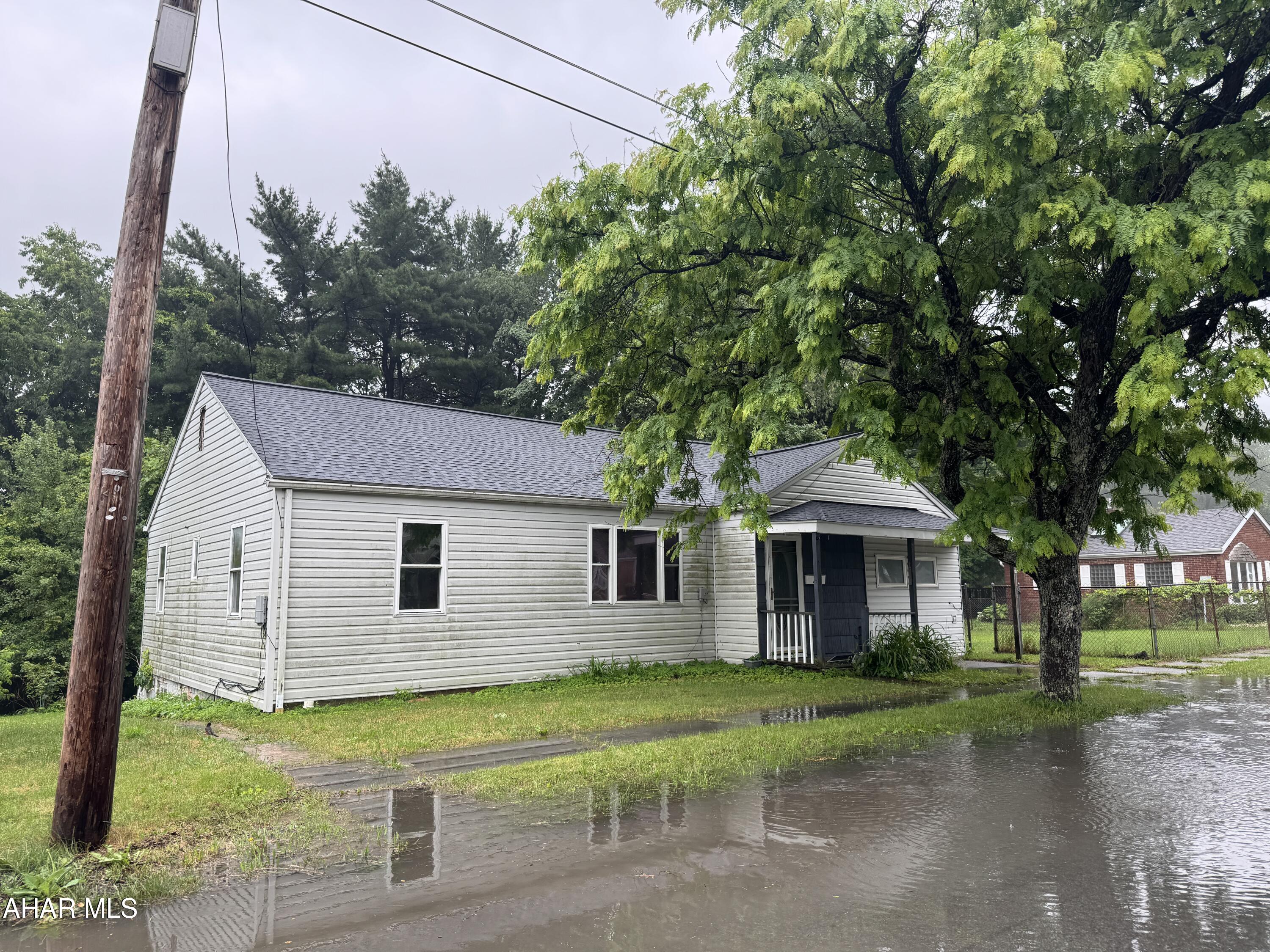 Fixer upper! 2-BR, 1-BA ranch w/fireplace in living room, partial basement and attic storage.