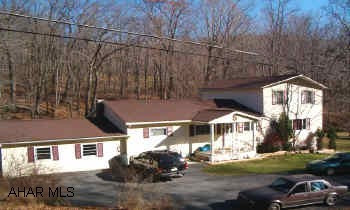4 BR, 2.5 BA on over 1/2 acre with stream, oak kitchen, master suite with walk-in closet and bath, country setting, 3 zoned hot water oil heat and domestic hot water oil, new well pump.