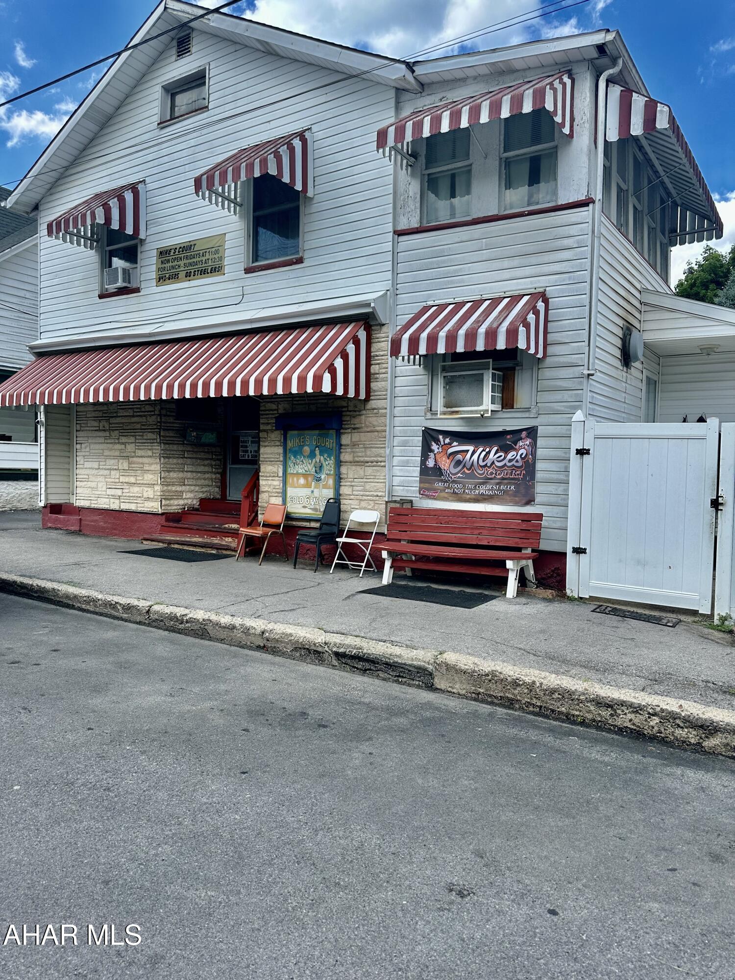 BUILDING ONLY for sale. Endless possibilities for this property.....use it as a rental and make the first floor into an apartment or several apartments  (2nd floor is already rented). Use it as a store front, skills machine facility or as a gathering place with the outdoor area.