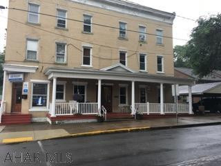 Formerly the Williamsburg Hotel - so much history!  In the heart of Williamsburg is this 7 unit building with 2 commercial tenants and 5 residentials.  Excellent rental history.  Owner pays heat, water, sewer and trash.  Tenants pay their own electric.  Hair salon has electric heat.  Tenants pay for her electric.
