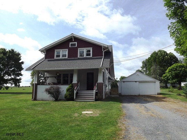 Very nice flat lot. Yard is partially fenced. Much character in this 1929 2-story home w/ large and open main floor. One enclosed porch! Minute to Chestnut Ridge Schools. Detached 2 car garage.