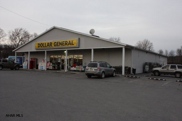 Former Dollar General Building. 8,000 sq' building on 1 acre with parking area. Built in 1998, shingle roof. 2 AC units.