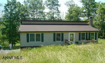 3 bedroom, 2.5 bath ranch with finished basement on almost an acre of ground. Oil stove in family room.