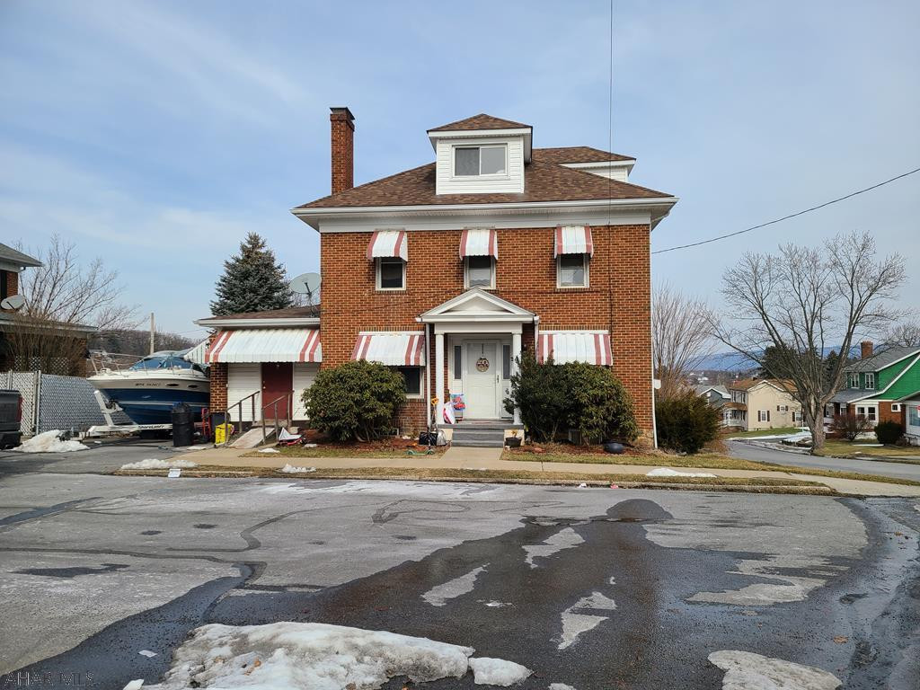 Brick home w/awnings on a corner lot in Fairview. Features include hardwood and tile floors; a fireplace in the living room; a large sunroom with a separate entrance; a big picture window in the dining room; hot-water, natural gas heat; a large master bedroom; a walk-up attic; a large deck; a fenced yard; and off-street parking.  Sellers will provide buyers with a 1-year home warranty from American Home Shield (Shield Essential).