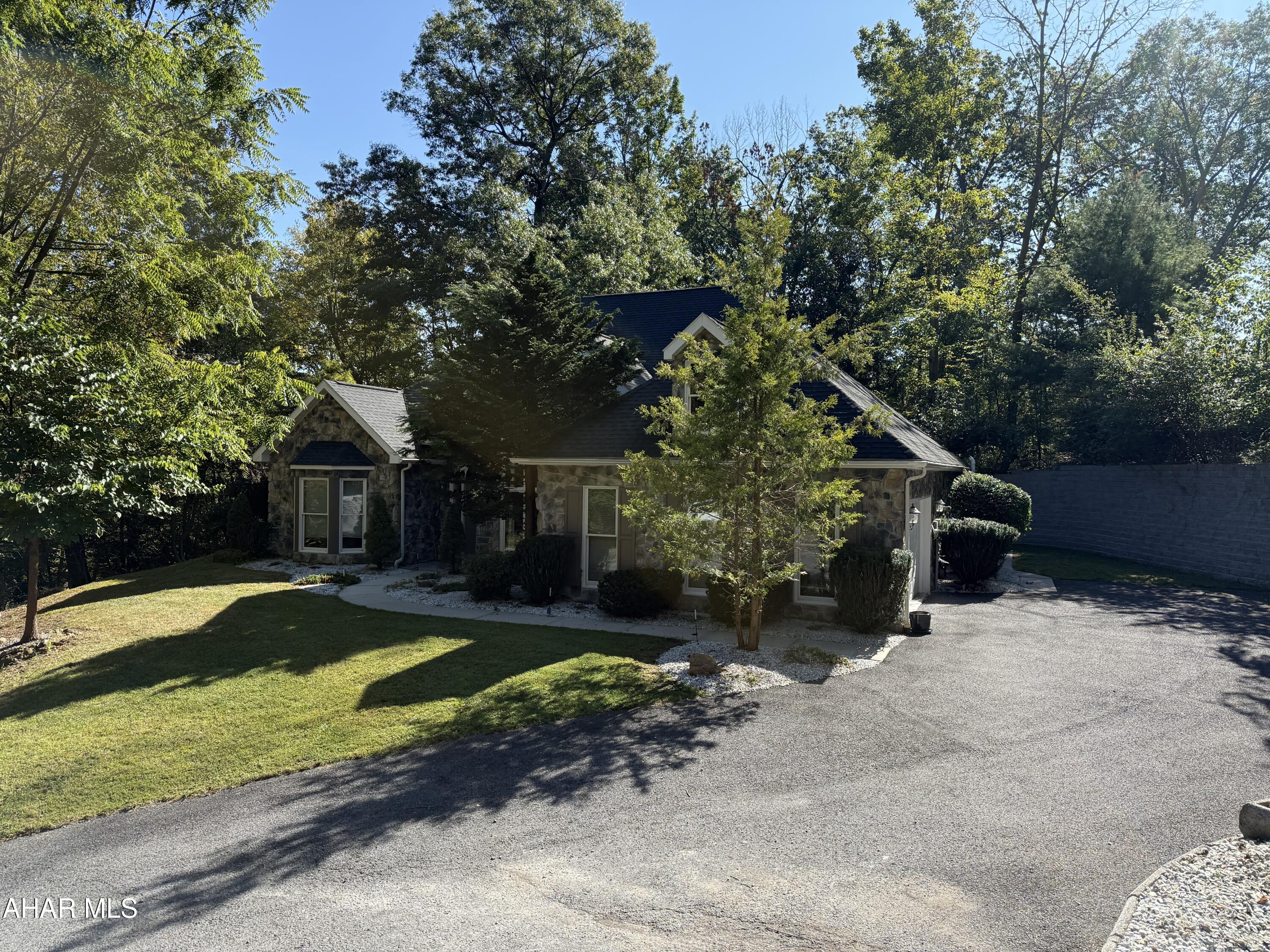 BUYERS!!!,IF YOU ARE LOOKING FOR NOT ONLY A IMACULATE HOME INSIDE& OUT BUT A SPECTACULAR ONE LEVEL  STONE HOME THIS IS IT. THIS HOME HAS A SPACIOUS MASTER SUITE ALONG WITH TWO OTHER  BEDROOMS AND 3 BATHS. IT IS SURROUNDED BY NATURE AND IS VERY PRIVATE. NATURAL GAS HEAT AND AC. OUTSIDE PATIO INTRODUCES GRILLING OUT TO A CONVEINANT SPACE BEING ALL ON ONE LEVEL.THIS HOME IS TURN KEY AND NEEDS  ONLY YOU. THEY DONT COME ALONG LIKE THIS ONE VERY OFTEN.