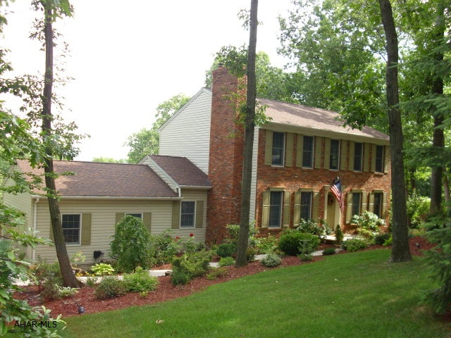 A private world with the cloistered rear yard, porches, and deck.  The family room and sun room provide additional privacy.  This 2 story home in Stonehedge includes 3 Bedrooms and 3.5 Baths.  There is an additional suite that could be the 4th Bedroom.  Rustic eat-in kitchen.  Some hardwood floors.  Game room.