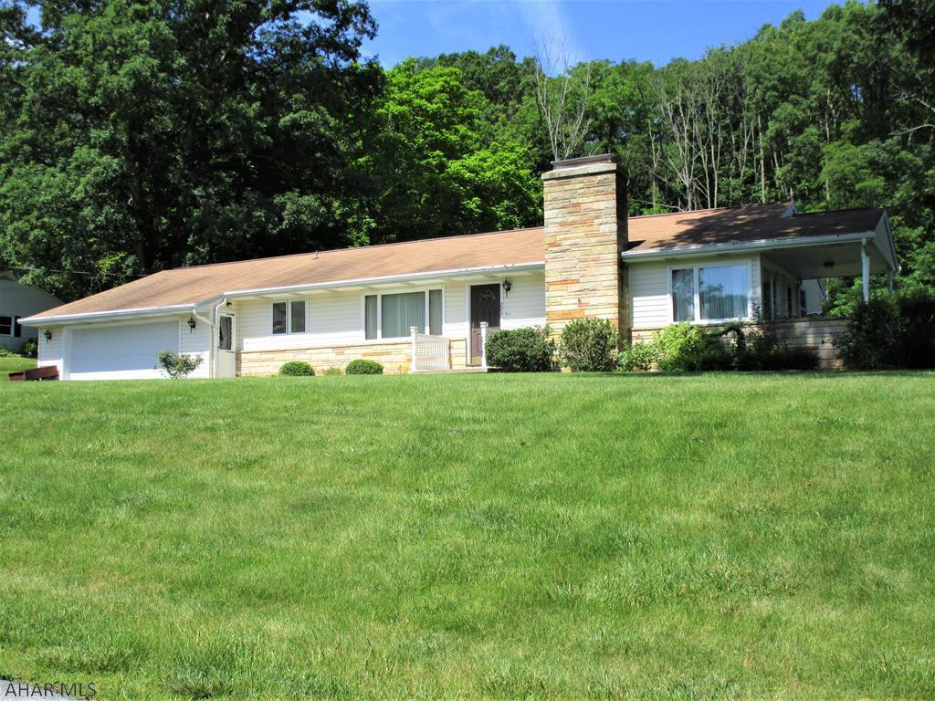 Very nice home on a landscaped lot with excellent street appeal in a lovely residential build-up!    Updated kitchen & baths!  Relaxing side porch.  Lg. 2-car garage w/ lots of space for lawn equipment + a paved driveway.  Finished, main-level laundry/hobby rm. with a wall unit air cond. & elect. baseboard heat. Excellent closet space.  Attractive basement family room/office w/ built-ins also with elect. basebd. heat + a freestanding gas stove. Many "Pella" replacement windows w/ built-in blinds.  Radon mitigation system.