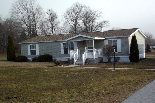 Well maintained, maintenance free double wide on 1.29 acres. This spacious 3 BR, 2 BA home features a relaxing year around sunroom. Oversized two car garage with supersized paved driveway. Relax in the back yard with firepit and garden pond. Don't miss this one!