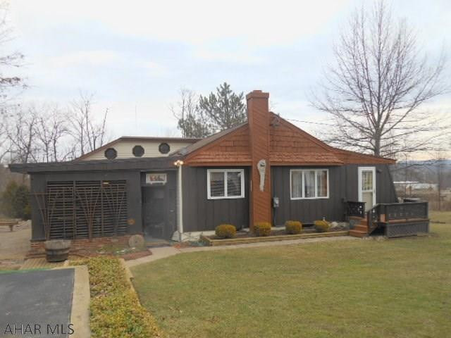 Wonderful, immaculate and unique country home on .61 acres. Nice eat-in kitchen with oak cabinets, living room has cathedral wood beamed ceilings. Sunroom, large bath with skylights. Den with fireplace. Lower level has finished Rec Room with wood burner, large workshop and storage. Delightful back enclosed patio, great 2 car garage with shed. Deck and older above ground pool.